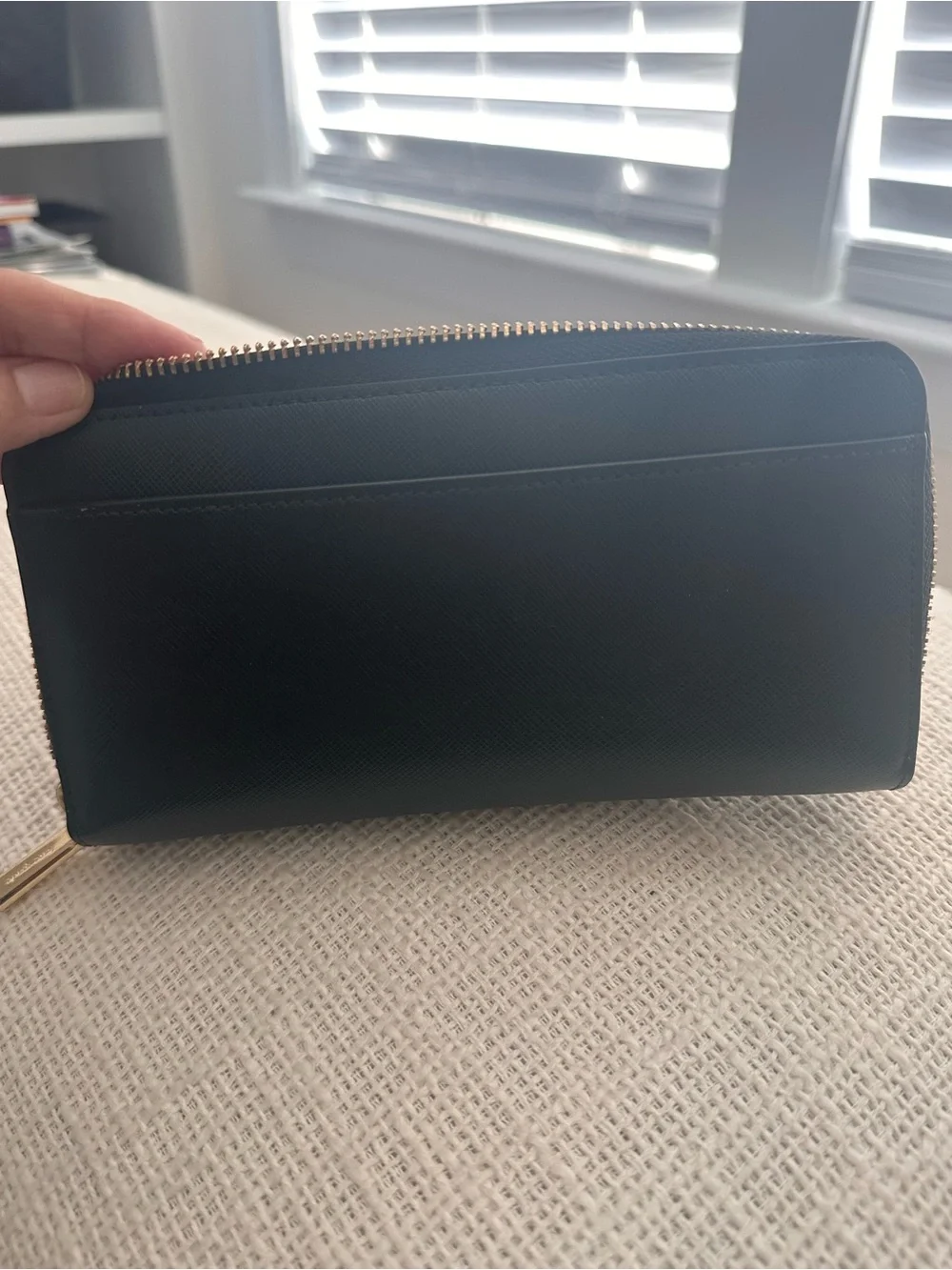 kate spade black Saffiano zip-around wallet with gold logo
